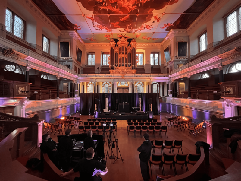 New lighting in the Sheldonian Theatre casting a peach coloured light over the theatre