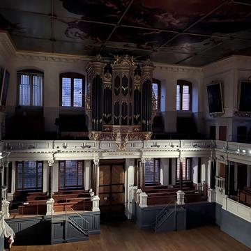 Sheldonian Theatre at night, illuminated by new lighting in the auditorium