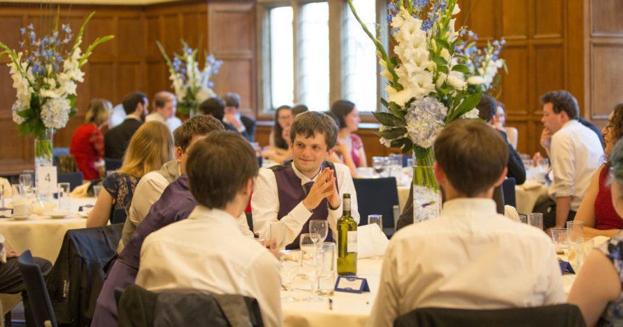This is an image of wedding guests sat at a reception table at the Examination Schools