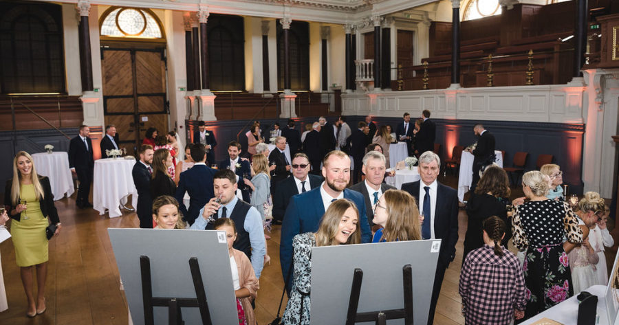 This is an image of guests at a wedding drinks reception held at the Sheldonian Theatre