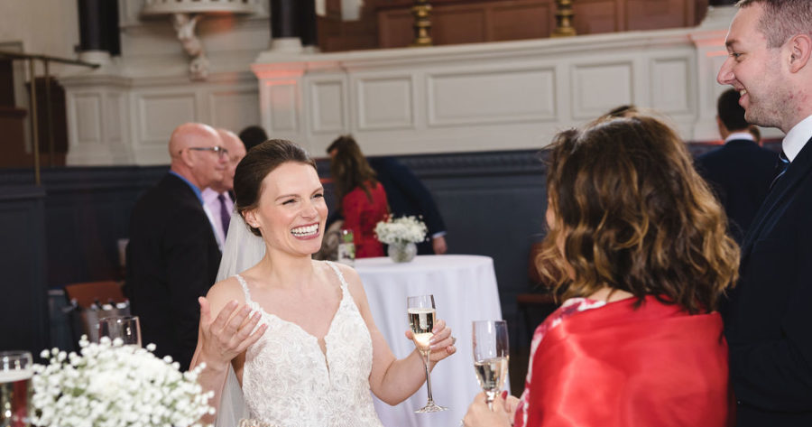 This is an image of guests at a wedding drinks reception held at the Sheldonian Theatre